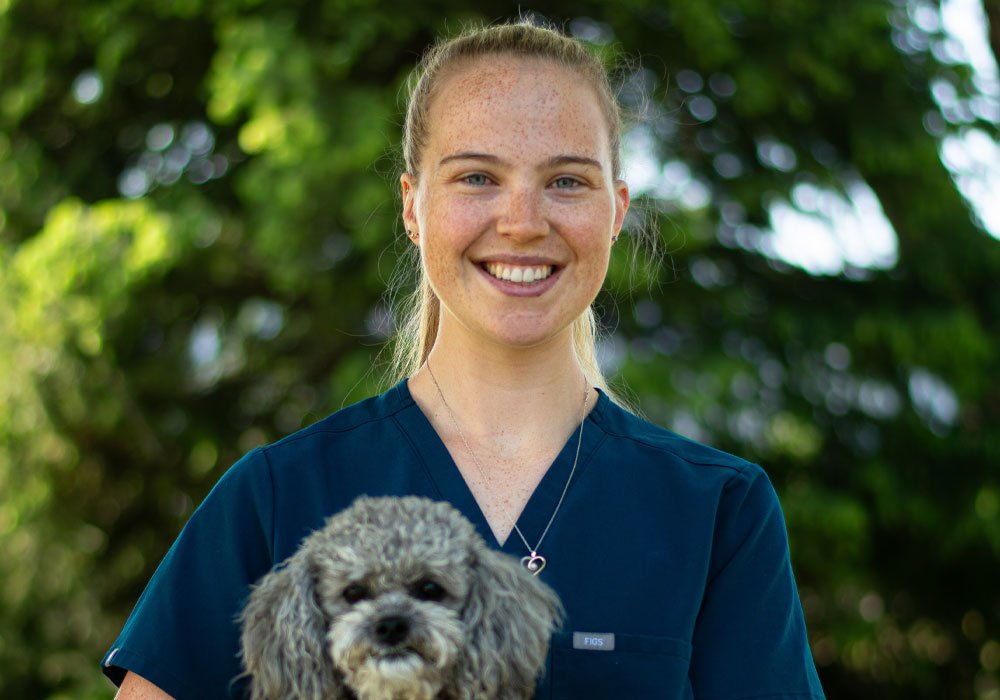 Dr. Emily Holding a small dog